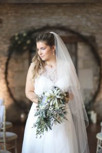 Bride looking to side in front of moongate | Journey to the Centre of the Earth | modern ethereal winter styled bridal shoot by Hanami Dream | agate | marble | airplants | tulle | pale blue | gold | Oxleaze Barn | Gloucestershire | October 2017 | Photography by Squib Photography www.squibphotography.co.uk