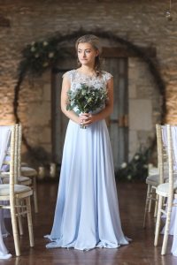 Bridesmaid in front of moongate | Journey to the Centre of the Earth | modern ethereal winter styled bridal shoot by Hanami Dream | agate | marble | airplants | tulle | pale blue | gold | Oxleaze Barn | Gloucestershire | October 2017 | Photography by Squib Photography www.squibphotography.co.uk