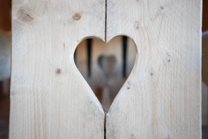 Heart in wooden bench | Journey to the Centre of the Earth | modern ethereal winter styled bridal shoot by Hanami Dream | agate | marble | airplants | tulle | pale blue | gold | Oxleaze Barn | Gloucestershire | October 2017 | Photography by Squib Photography www.squibphotography.co.uk