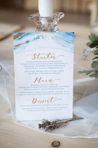 Watercolour menu with gold leaf | Journey to the Centre of the Earth | modern ethereal winter styled bridal shoot by Hanami Dream | agate | marble | airplants | tulle | pale blue | gold | Oxleaze Barn | Gloucestershire | October 2017 | Photography by Squib Photography www.squibphotography.co.uk