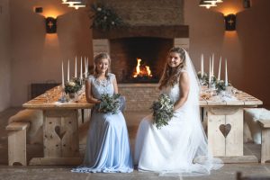 Bridal party in front of the fire | Journey to the Centre of the Earth | modern ethereal winter styled bridal shoot by Hanami Dream | agate | marble | airplants | tulle | pale blue | gold | Oxleaze Barn | Gloucestershire | October 2017 | Photography by Squib Photography www.squibphotography.co.uk